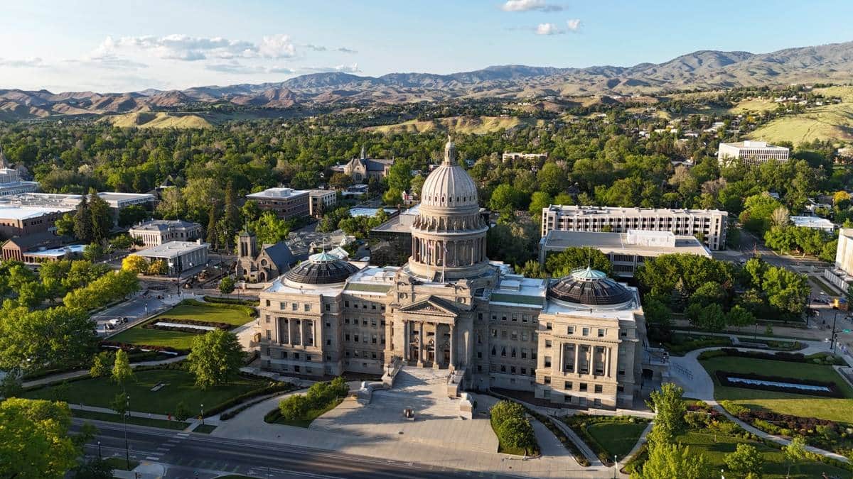The Idaho Capitol and downtown Boise below the foothills.